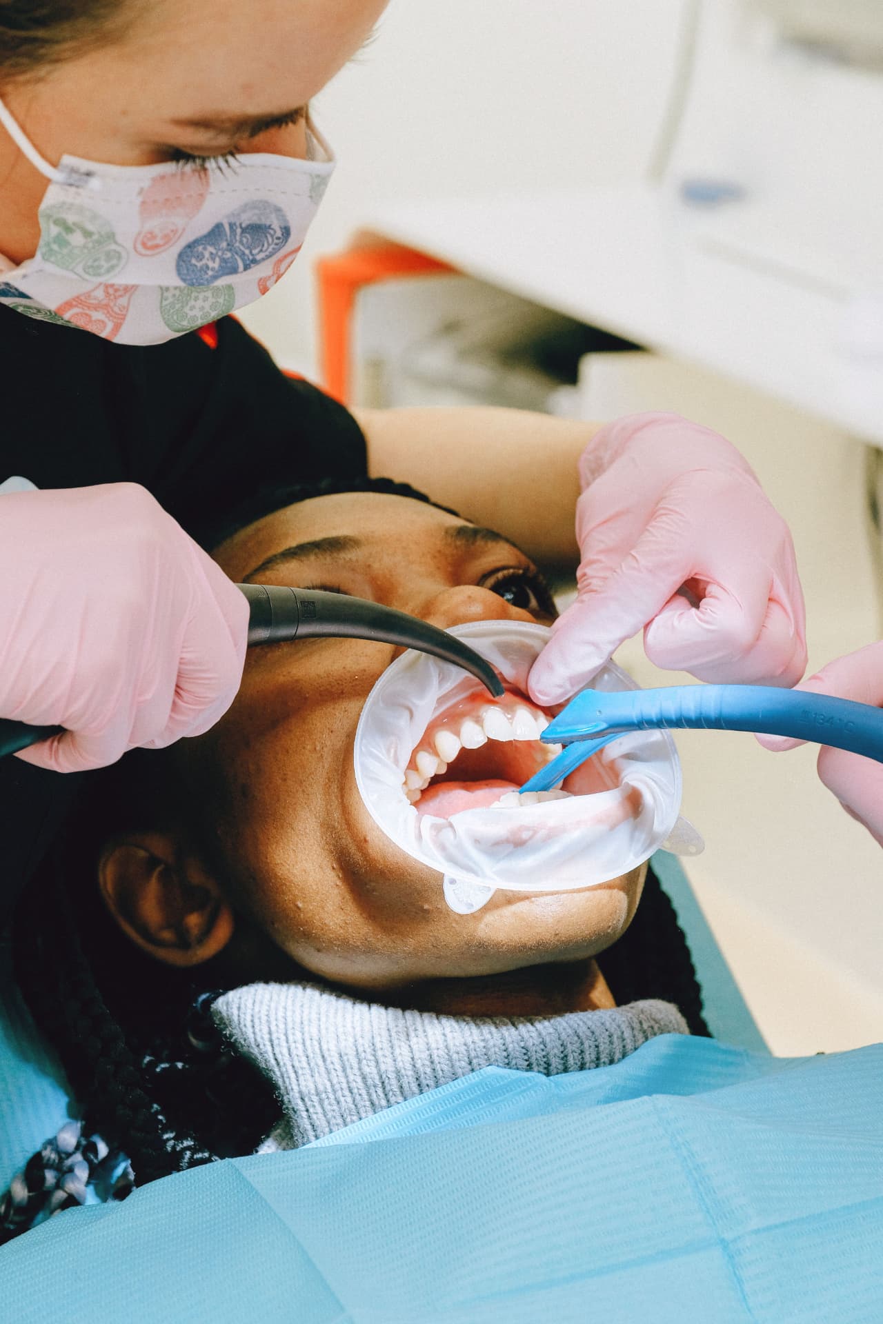 Dental hygienist performing a professional teeth cleaning
